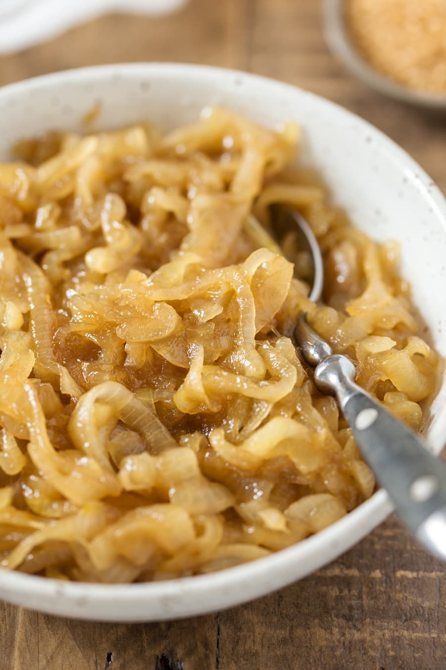 Detail of marsala caramelized onion in a ceramic bowl.