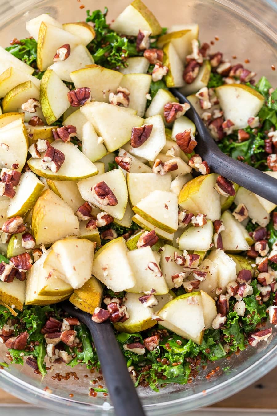 Pear and pecans added to kale salad.