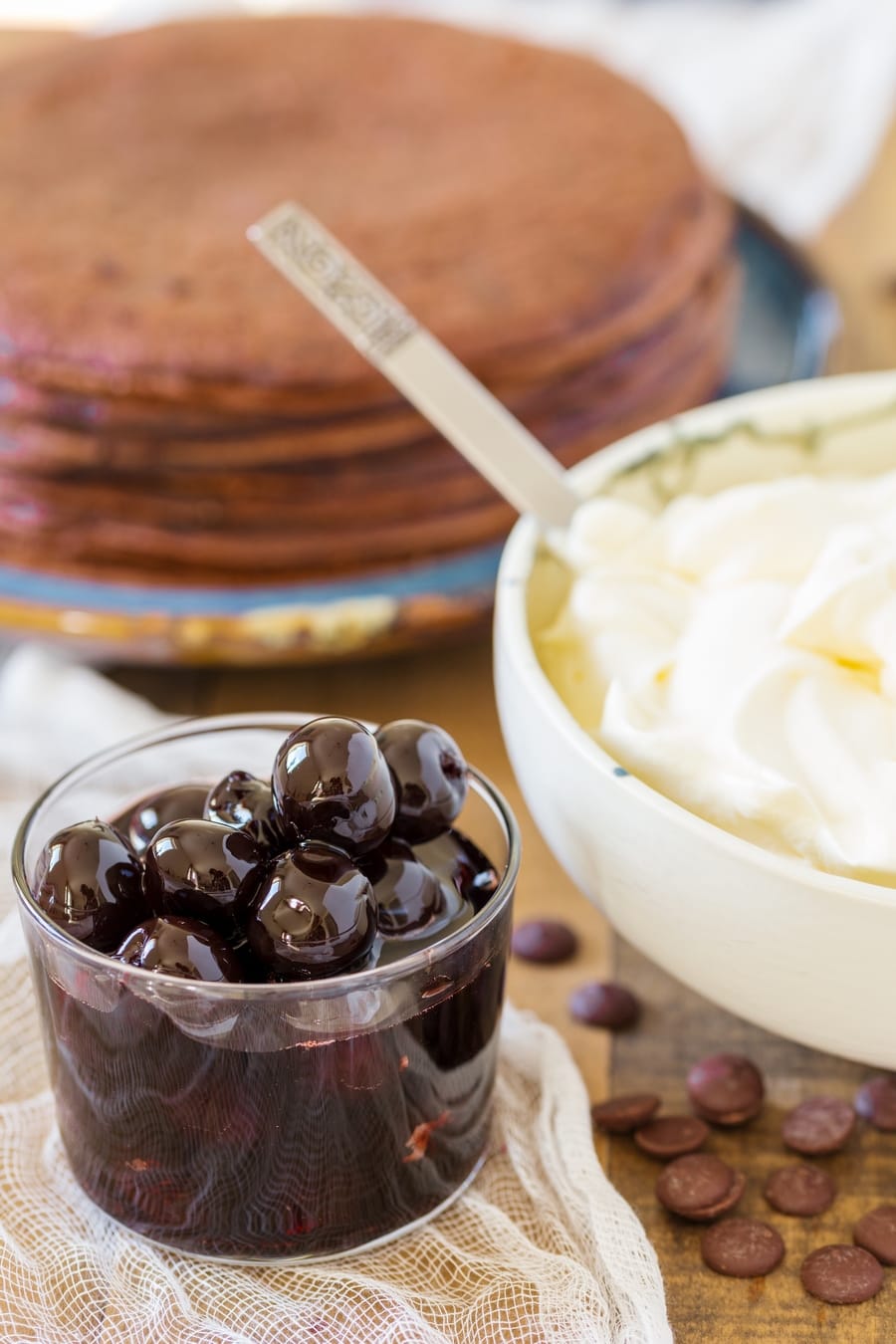 Sour cherries in syrup, whipped cream, chocolate crepes.