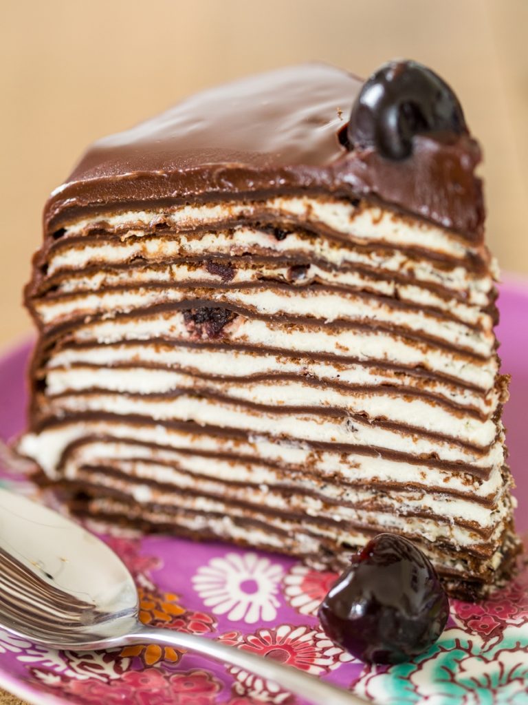 Slice of Black forest crepe cake.