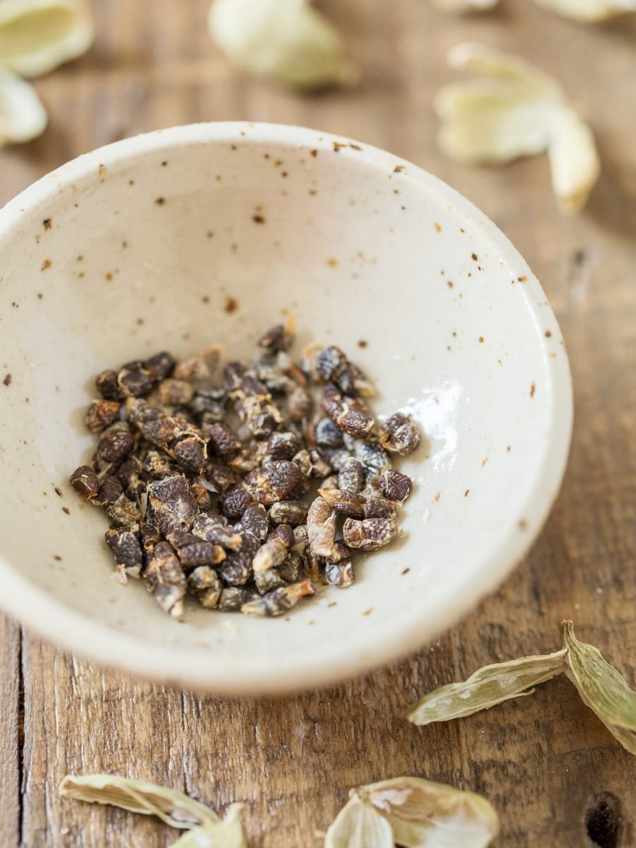 Cardamom seeds in a small bowl.