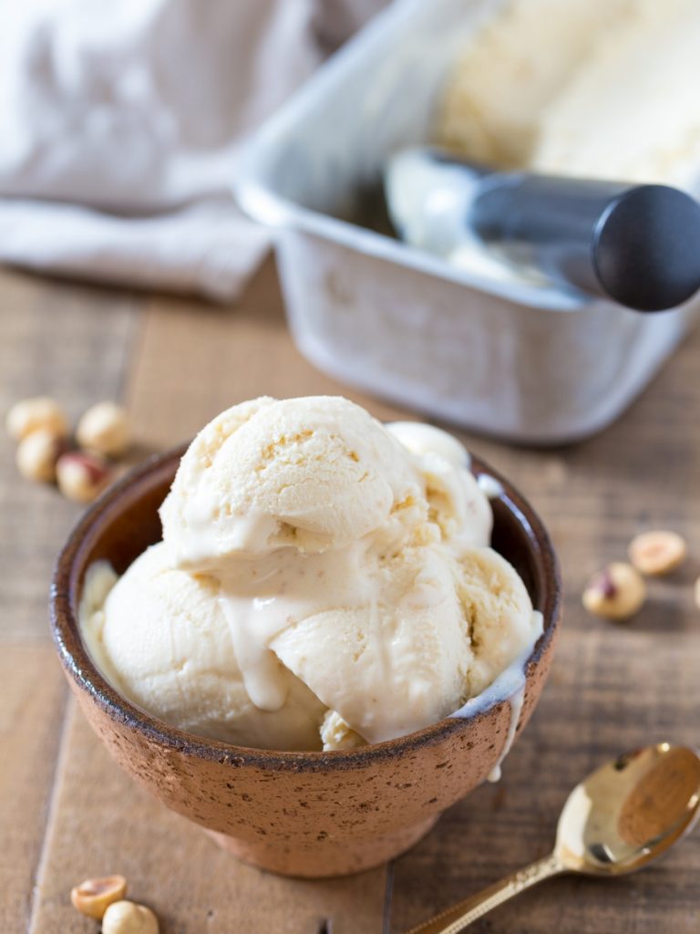 No-churn hazelnut ice cream served in a brown bowl.