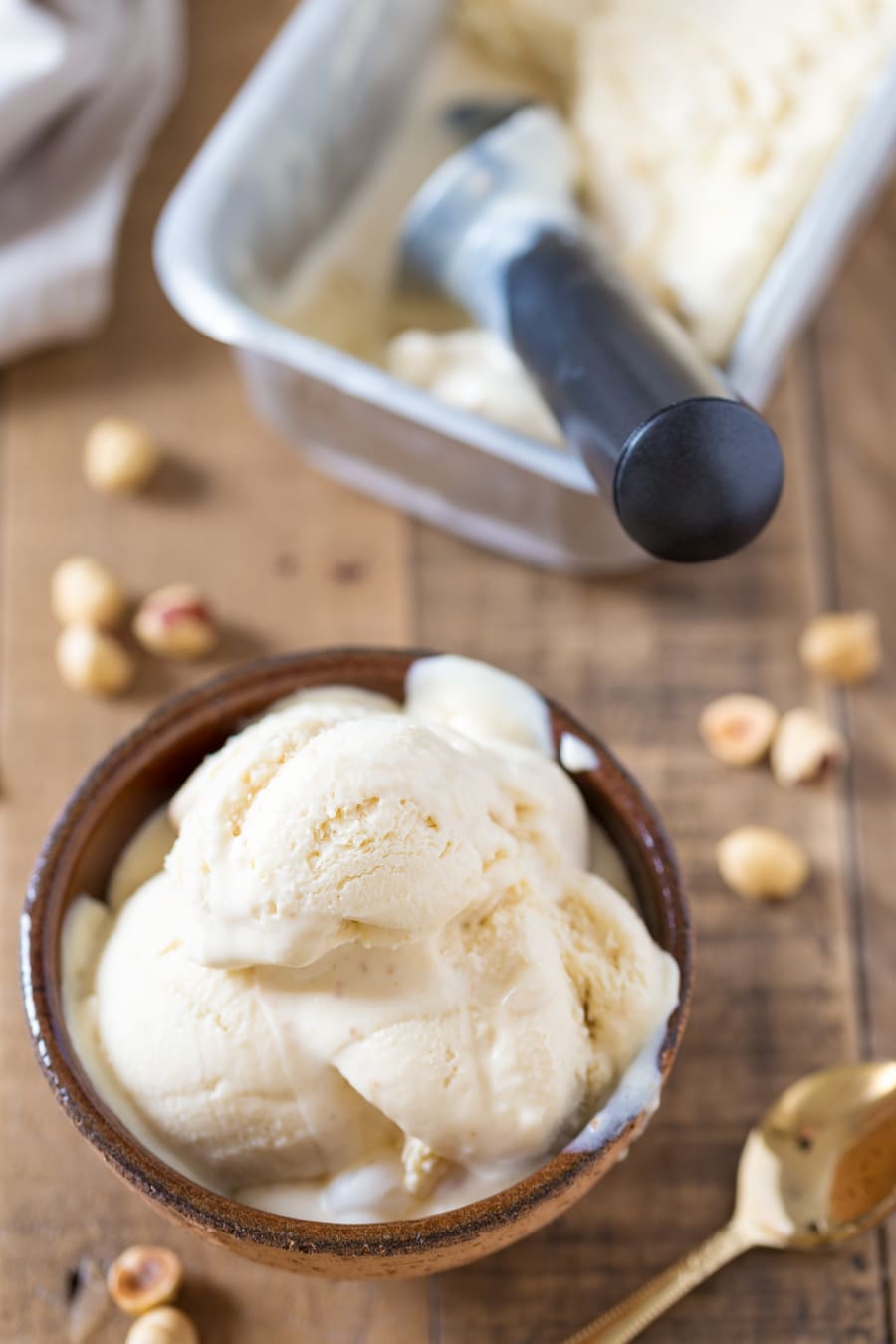 No-churn hazelnut ice cream served in a brown bowl.