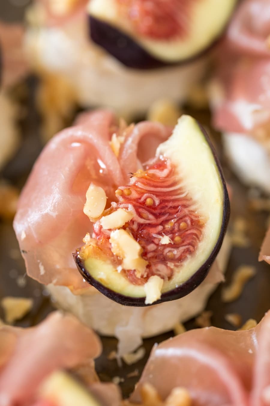 Baked goat cheese log with figs and prosciutto.