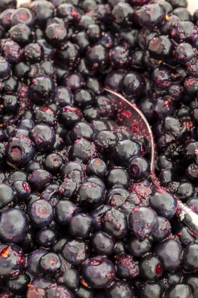 Closeup of blueberries mixed with sugar and potato starch.
