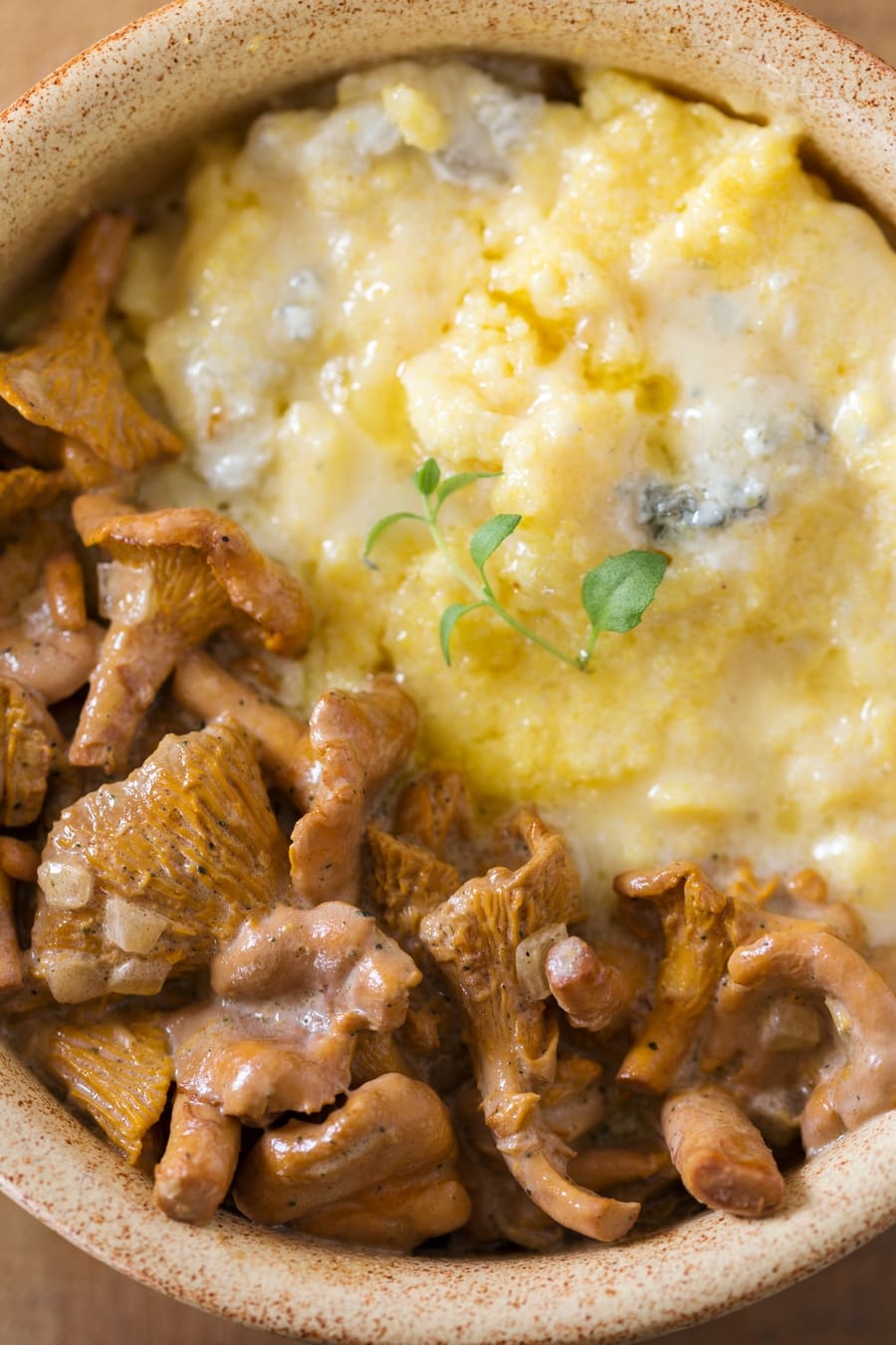 Closer view of polenta concia with chanterelle sauce.