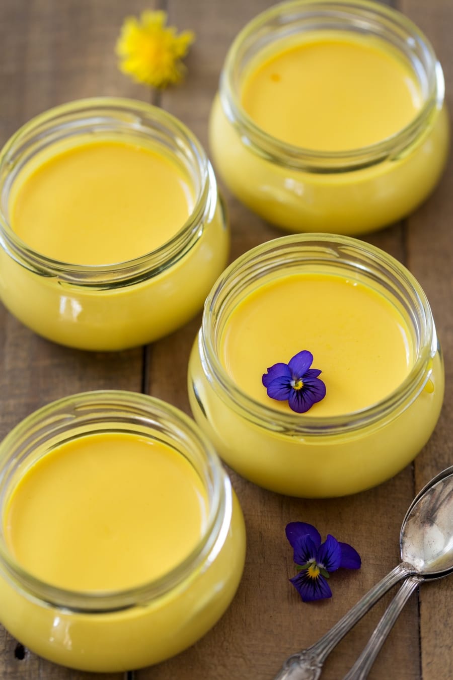 Small glass pots with saffron panna cotta.
