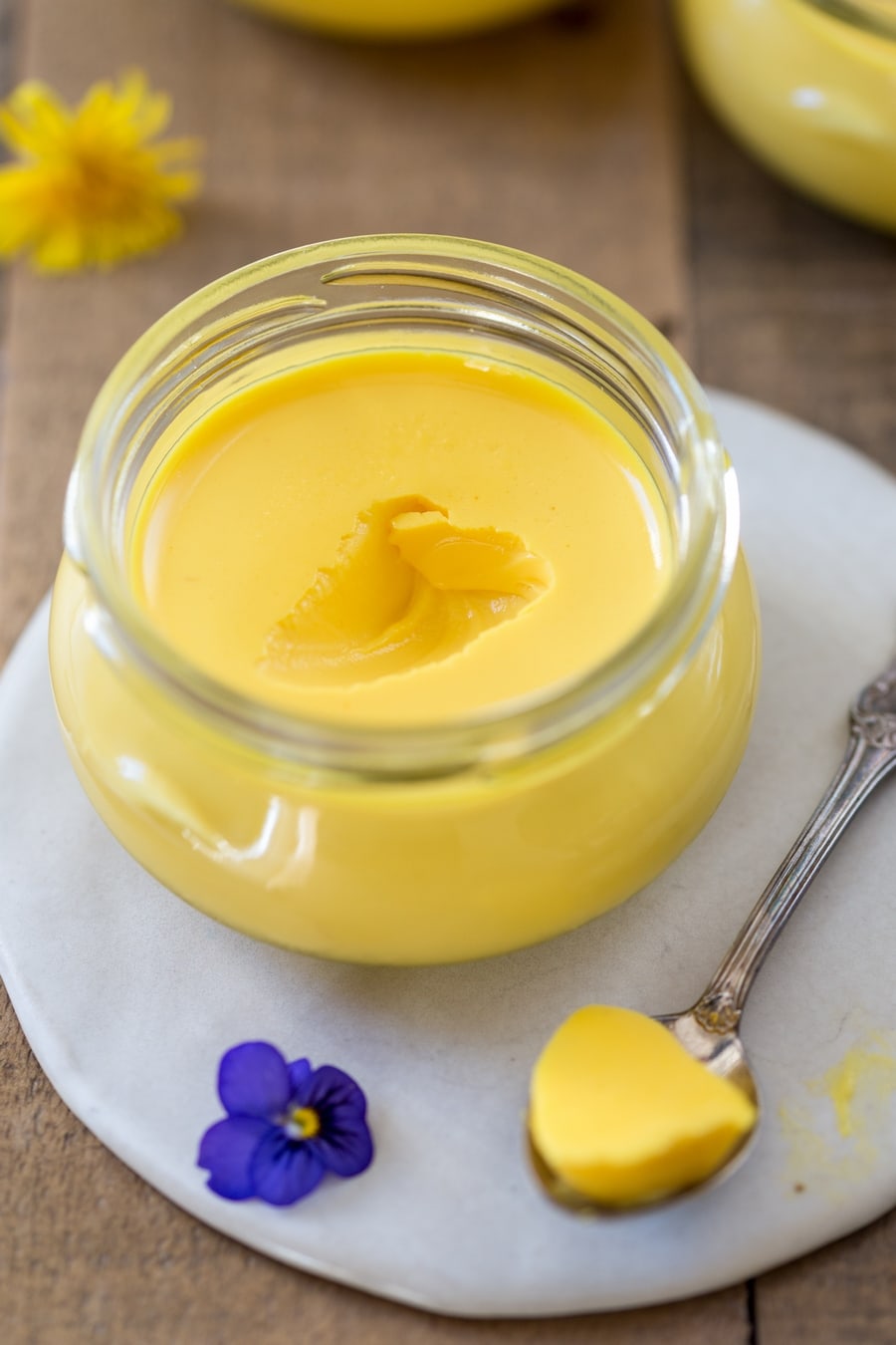 Saffron panna cotta, spoon on the side.