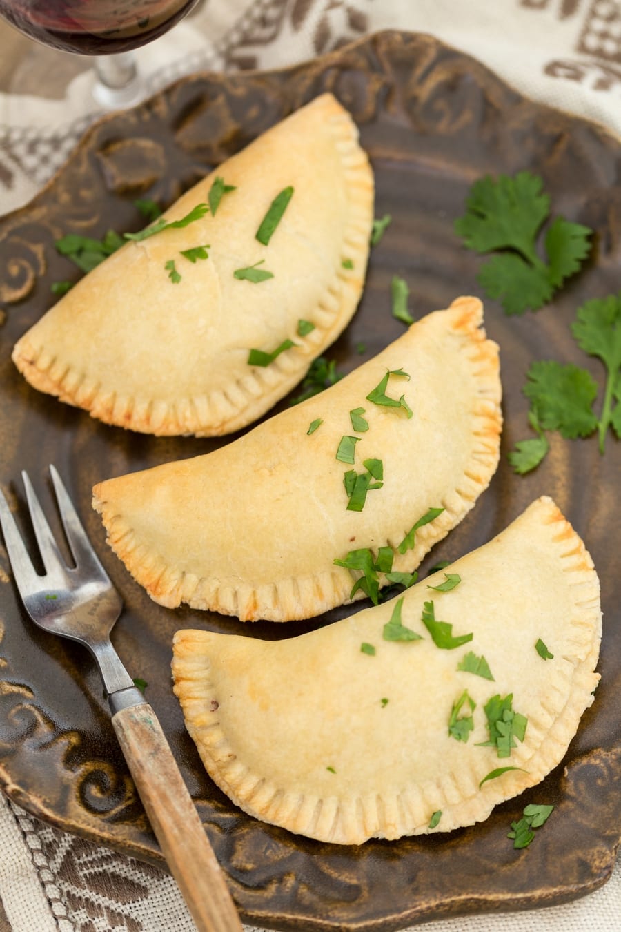 Baked empanadas on a plate.