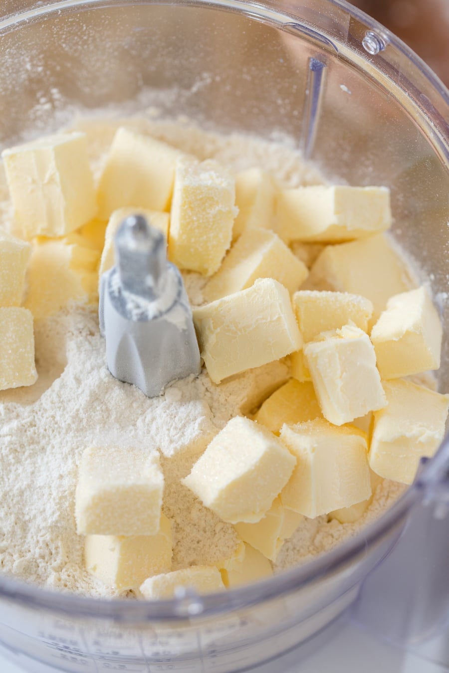 Cubed butter and flour in a food processor.