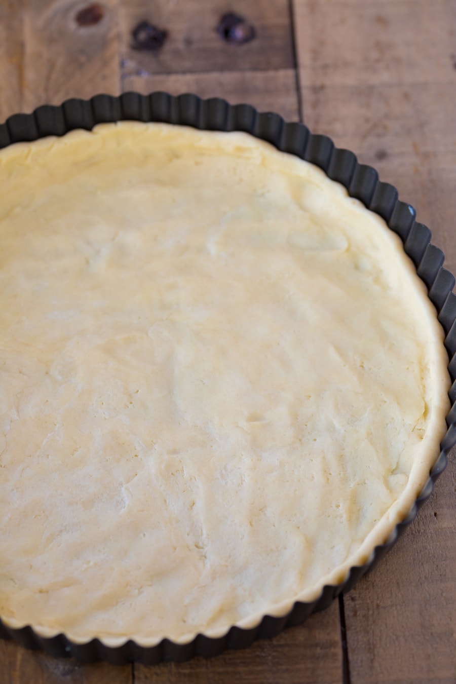 White wine shortcrust pressed into a tart pan.