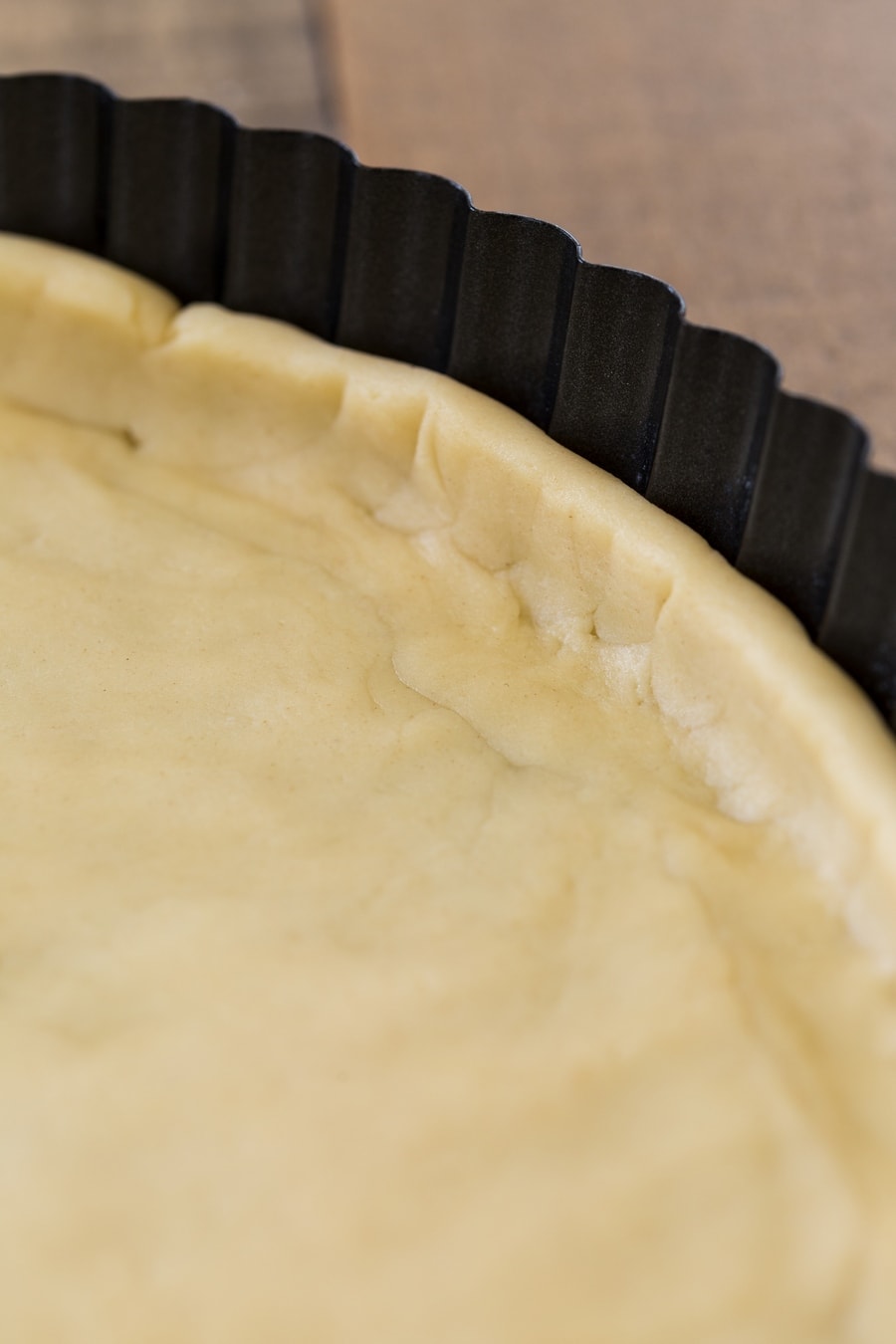 Shortcrust pastry in a tart tin.