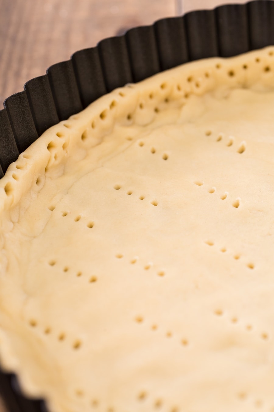Shortcrust pastry that has been pricked with a fork.