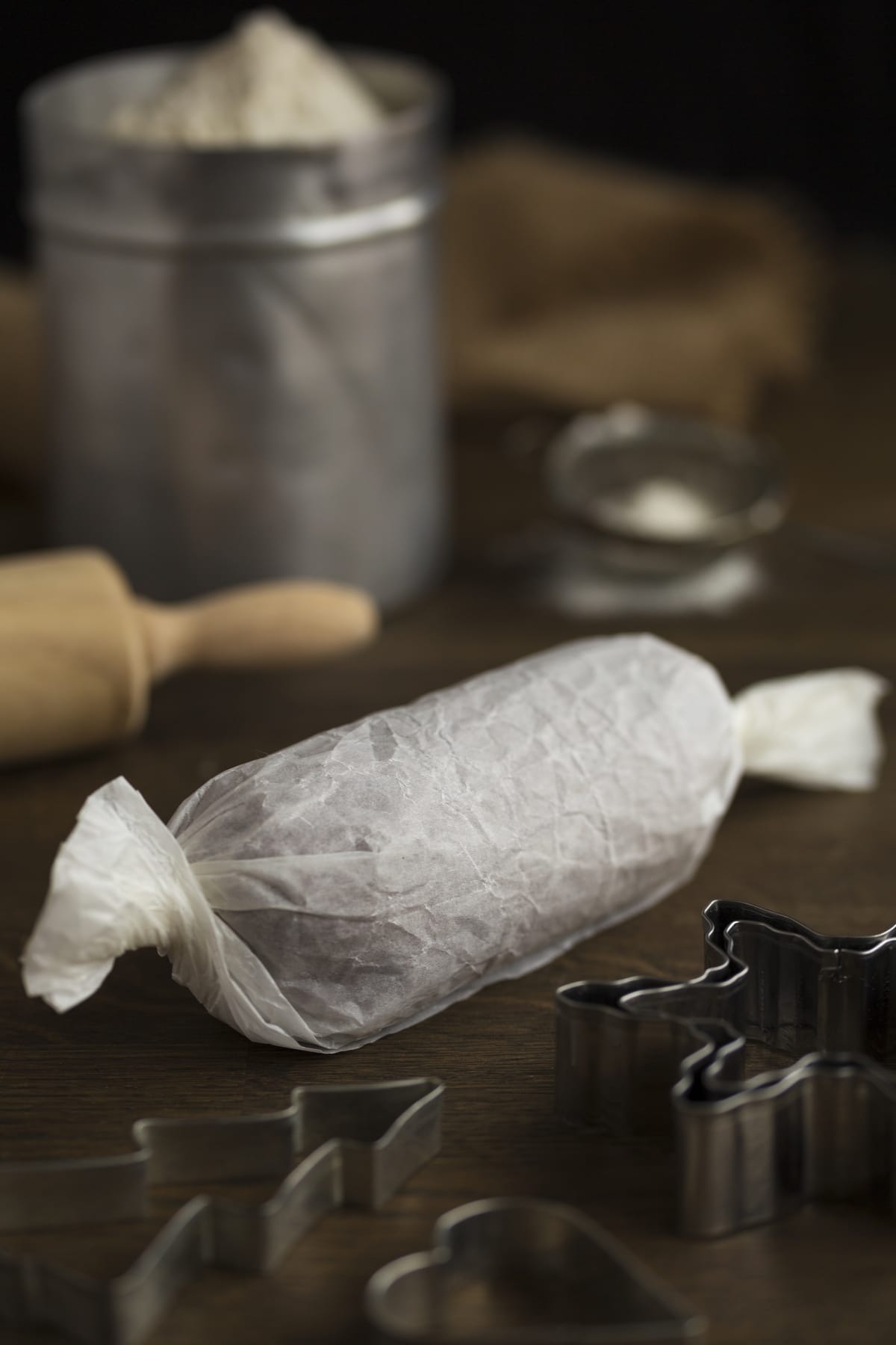 Cookie dough wrapped in baking paper like a candy.