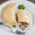 Venison empanadas cut open to show filling.