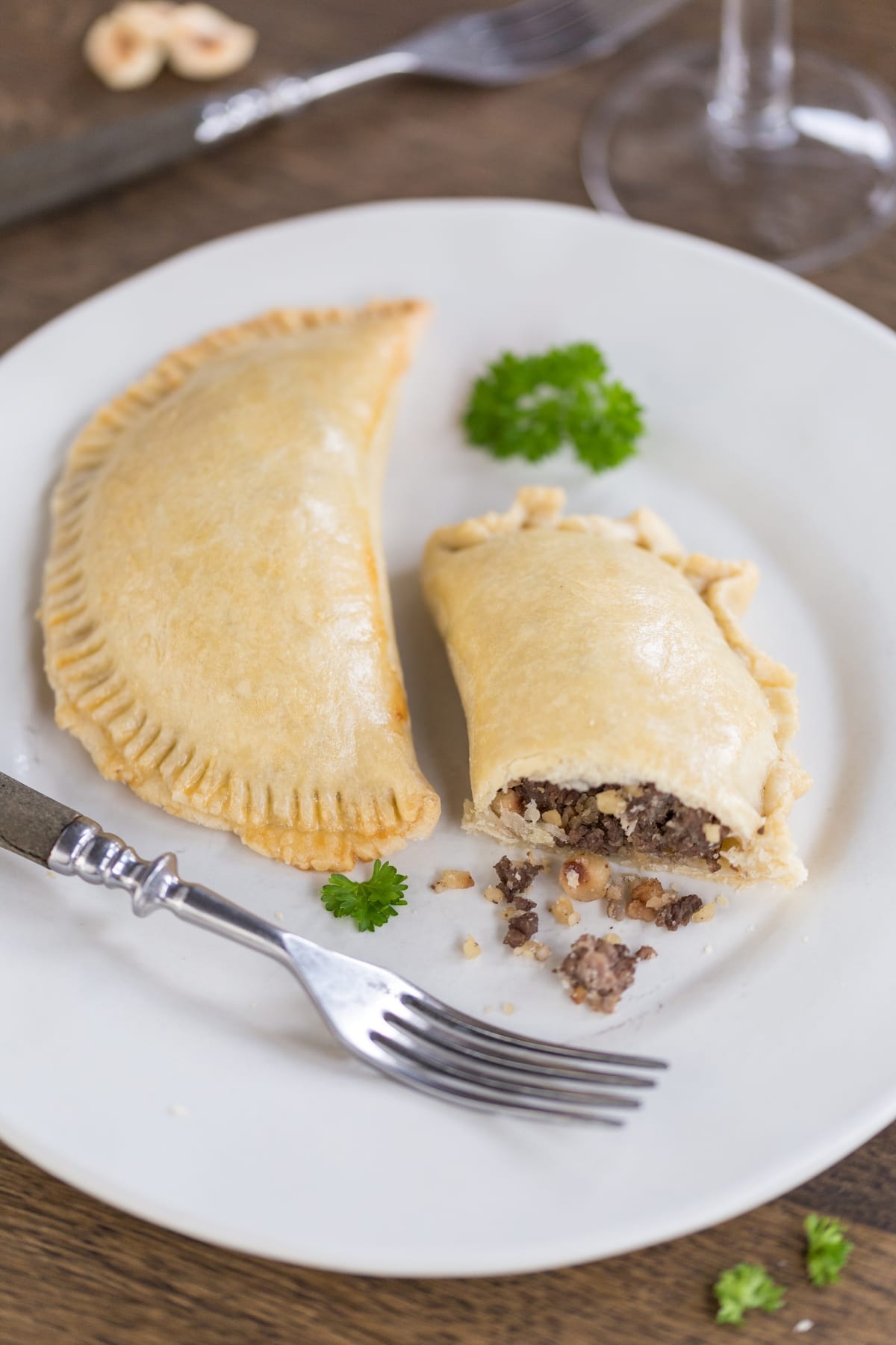 Venison empanadas cut open to show filling.
