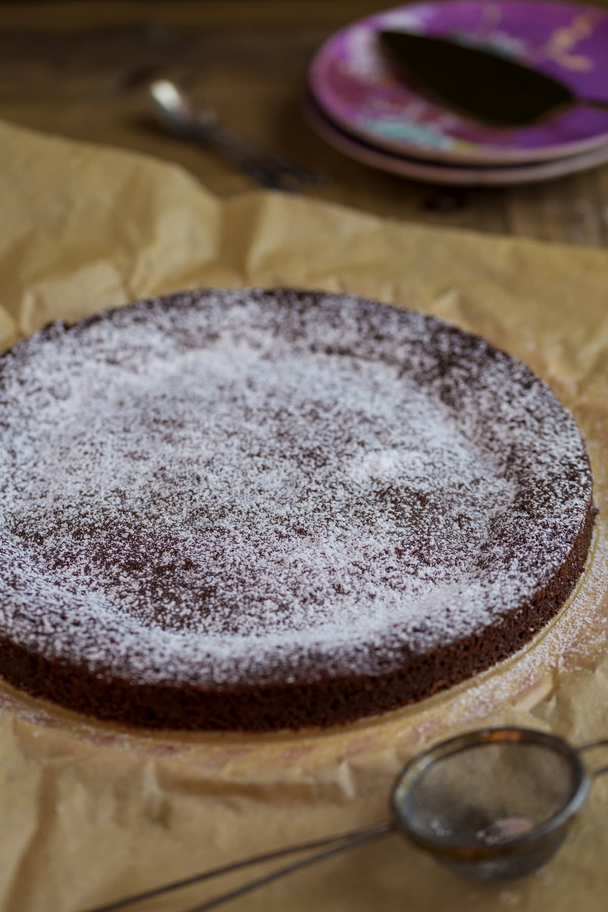 Chocolate cake dusted with confectioner's sugar.