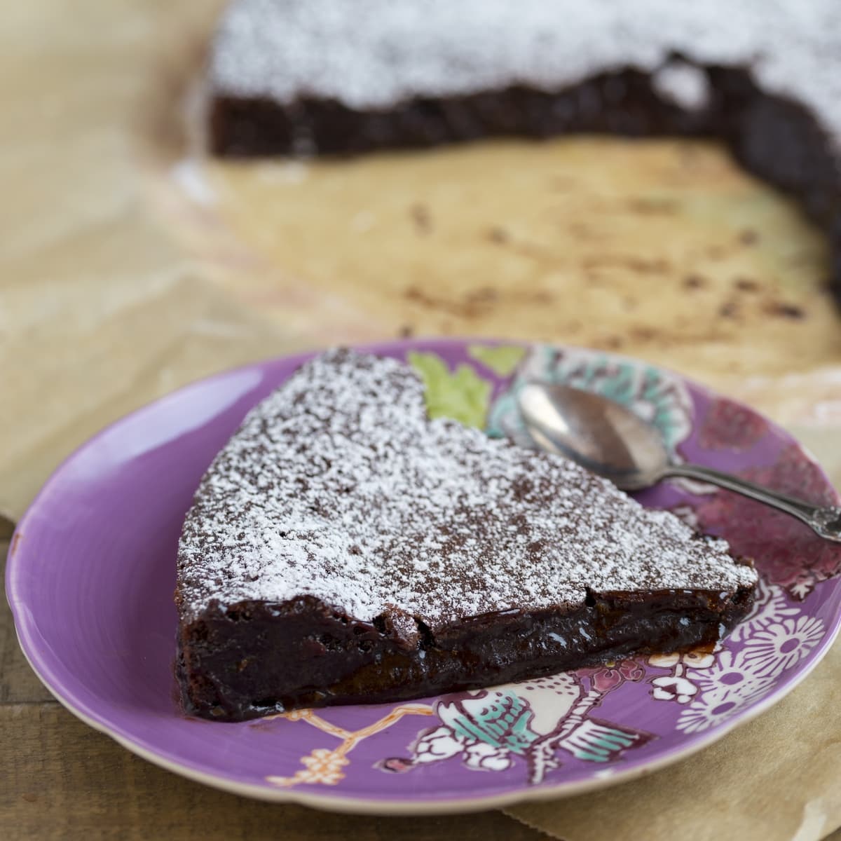 A slice of Swedish chocolate cake on a purple plate.