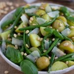 Baby potato salad with green beans and pesto dressing.