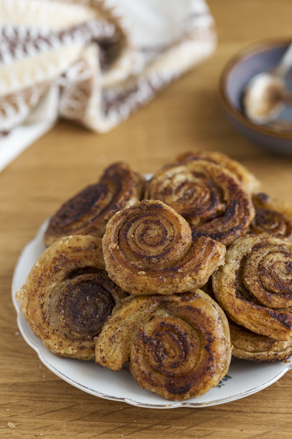 Cinnamon pinwheels piled on a serving plate.