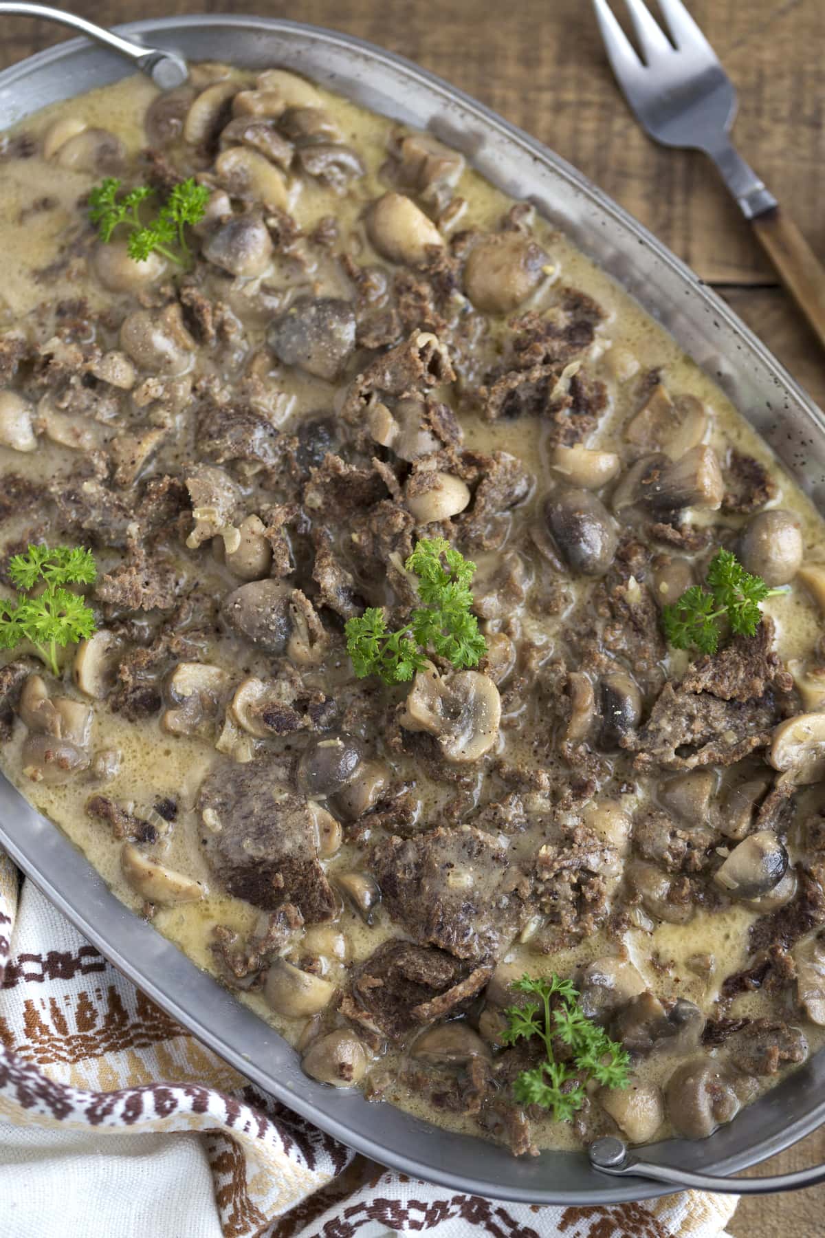 Reindeer stew with mushrooms in cream.