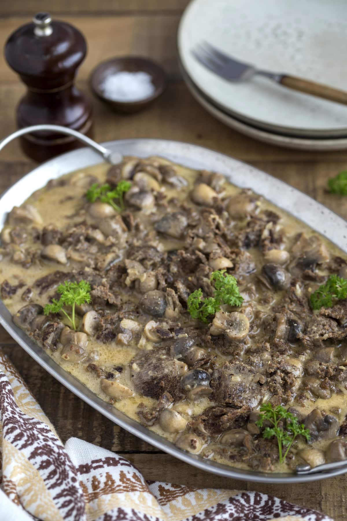 Reindeer stew with mushrooms (renskav) served with a creamy gravy.