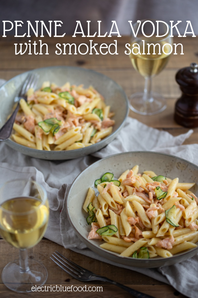 Salmon penne alla vodka is a modern take on a trendy recipe from the '80s. Penne pasta are tossed in a creamy salmon sauce where a splash of vodka has been added during the cooking process. Topped with soft zucchini and freshly cracked black pepper, this salmon pasta recipe is a delightful dinner ready in less than 30 minutes.