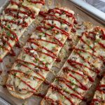 Polish open-faced sandwich zapiekanka with mushrooms and cheese.