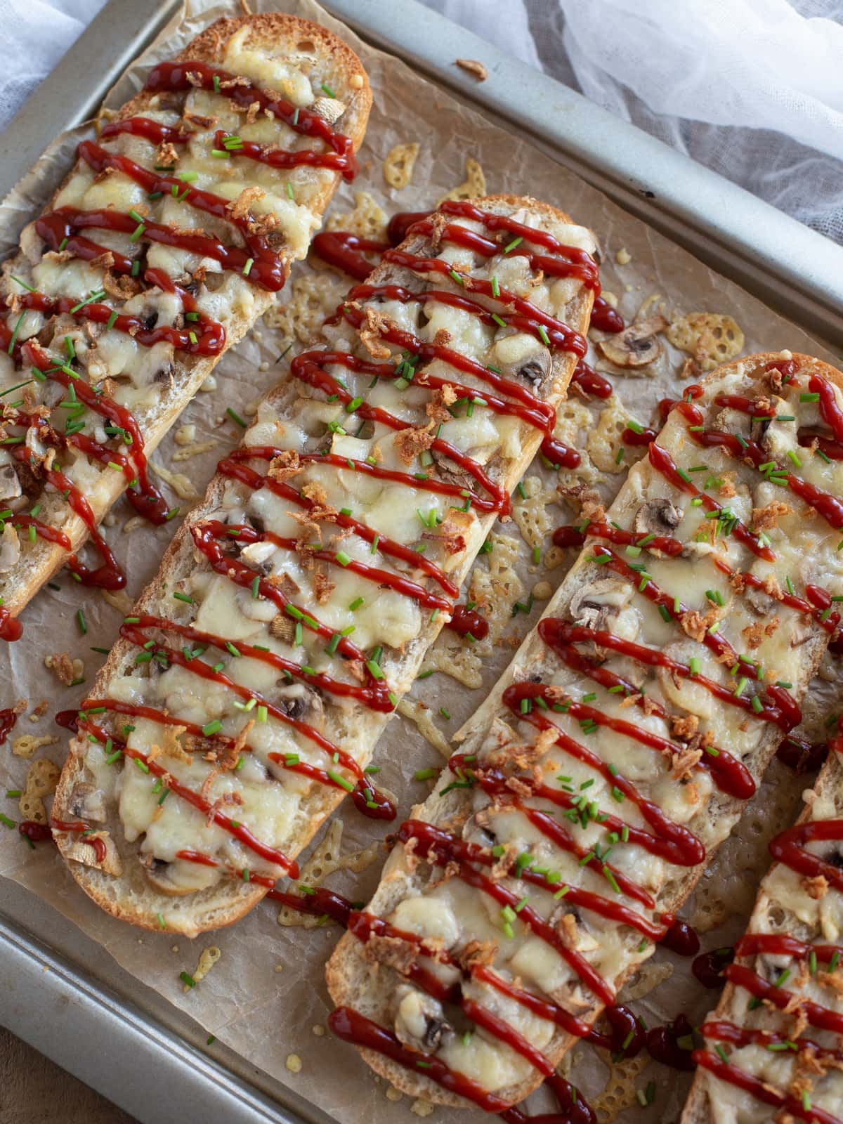 Polish open-faced sandwich zapiekanka with mushrooms and cheese.