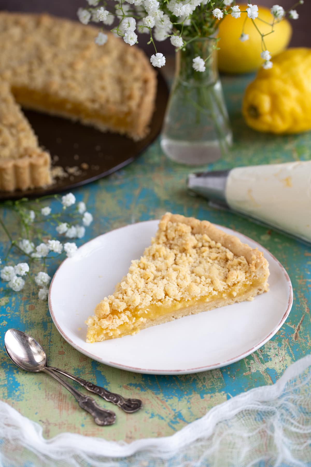 A slice of ginger lemon pie served on a white plate.