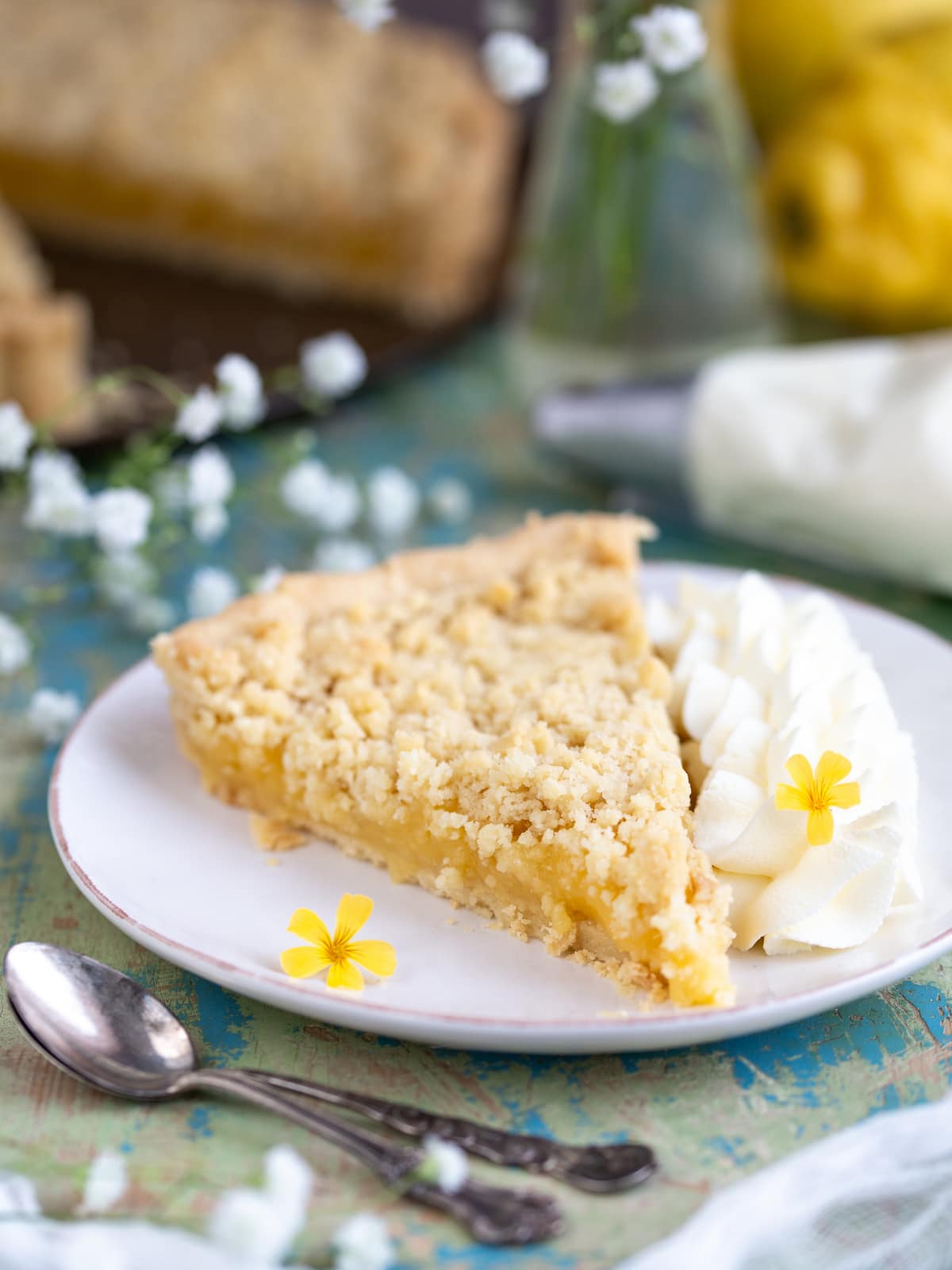 Sliced ginger lemon tart with whipped cream.