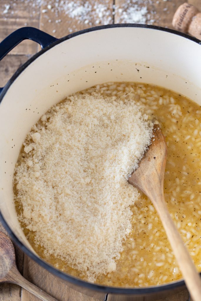 Adding parmesan to risotto.