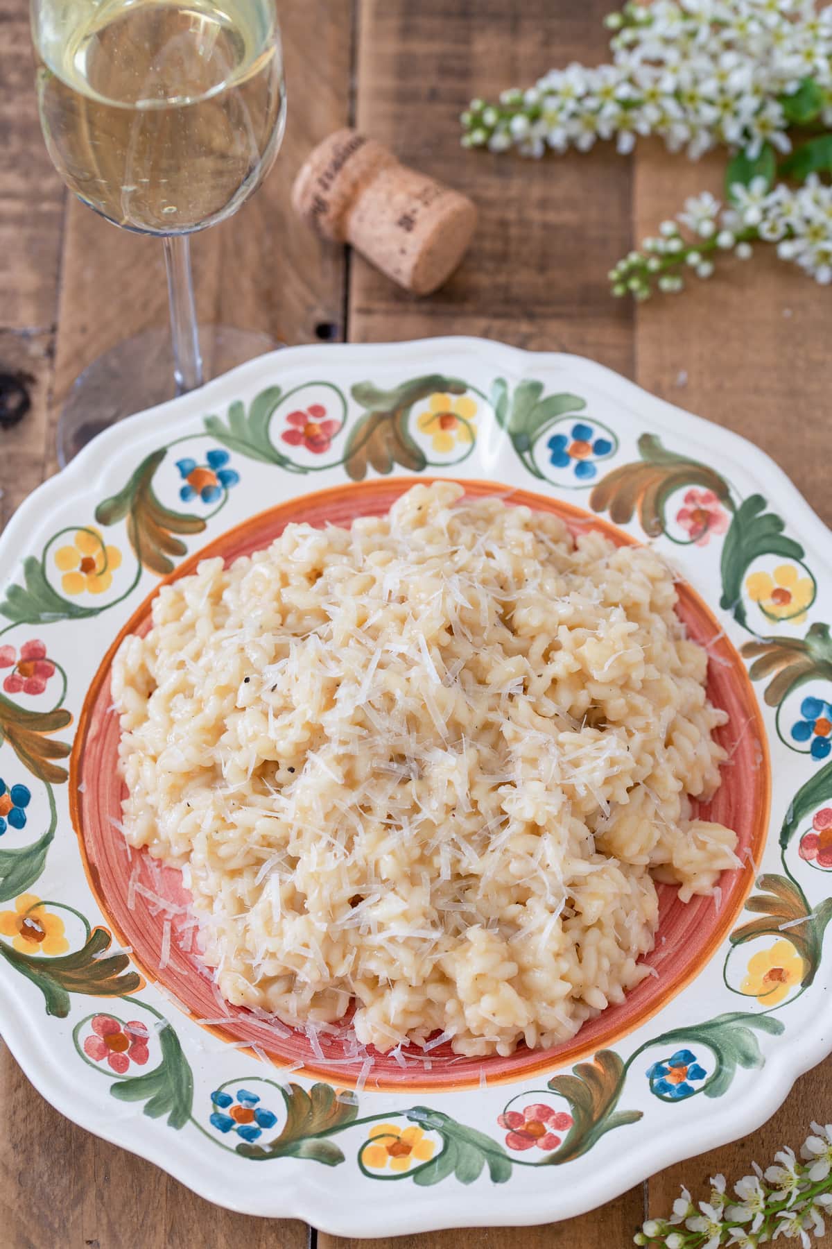 A portion of risotto served on a decorated plate.