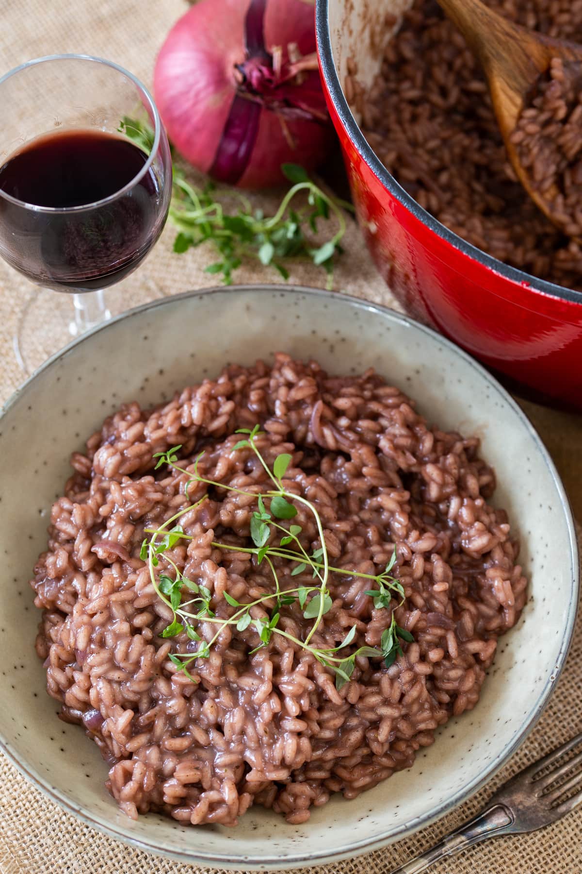 Simple red wine risotto topped with fresh thyme.