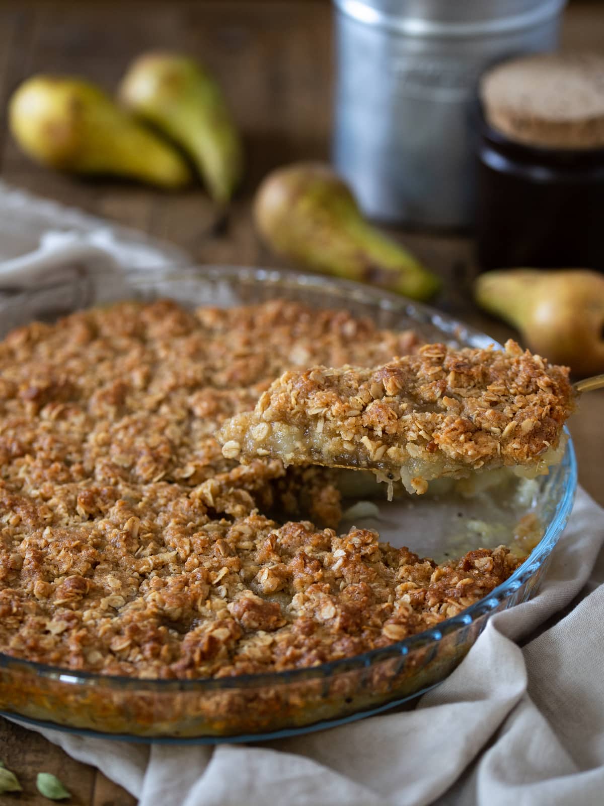 A slice of the crisp is being lifted off to be served.