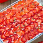 Overhead view of top decoration with sliced strawberries.