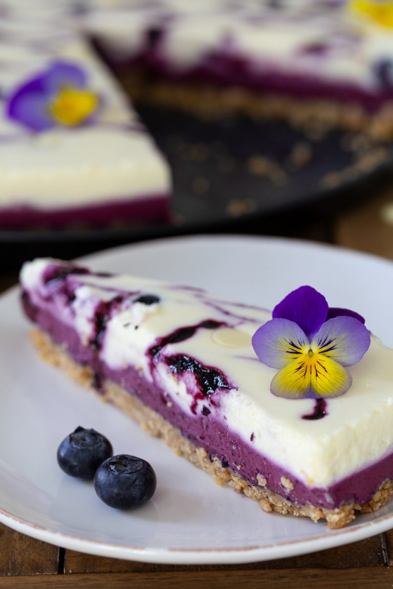 Blueberry white chocolate cheesecake sliced.