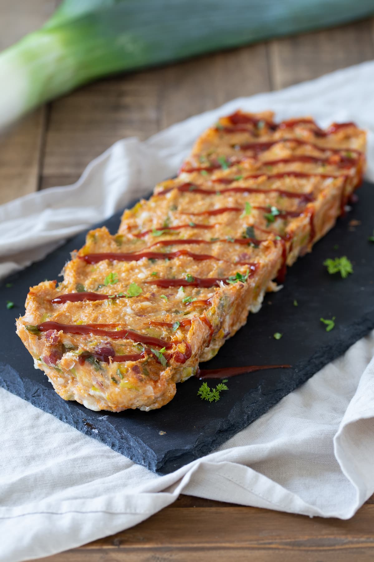 Chicken meatloaf drizzled with BBQ sauce.
