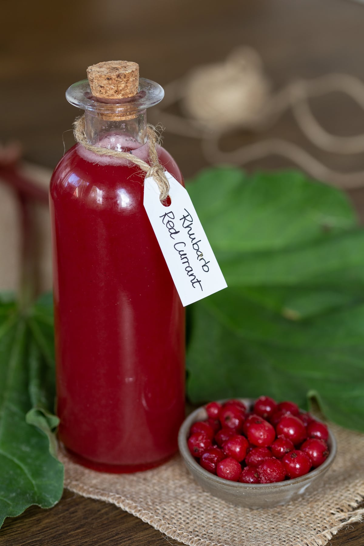 A bottle of rhubarb and red currant syrup.