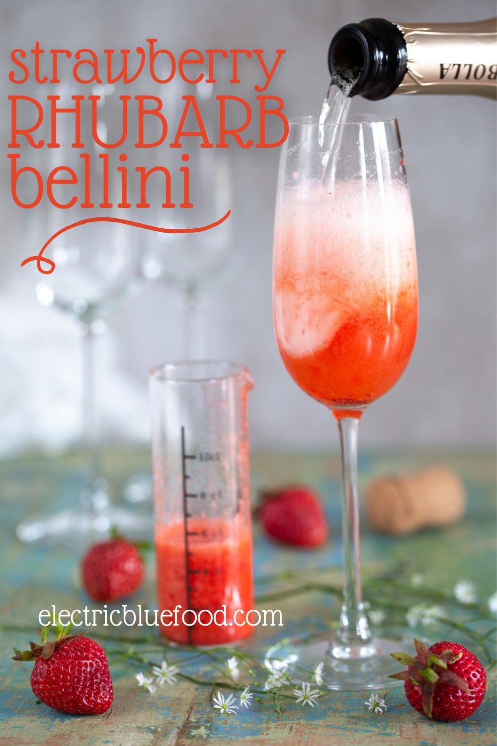 Strawberry rhubarb Bellini (rhubrb Rossini) a Prosecco cocktail with rhubarb syrup and strawberry purée.