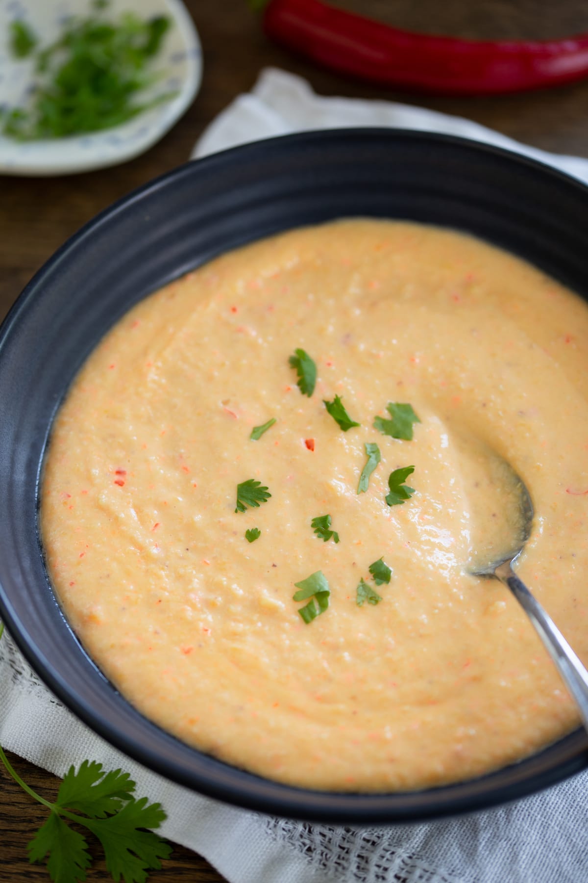 Soup topped with minced cilantro.