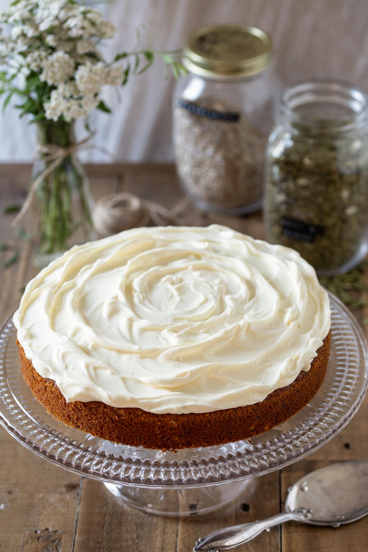 Carrot cake with cream cheese frosting on top.