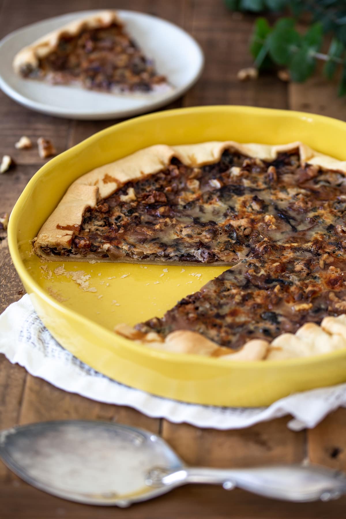 Radicchio blue cheese tart with a slice missing.