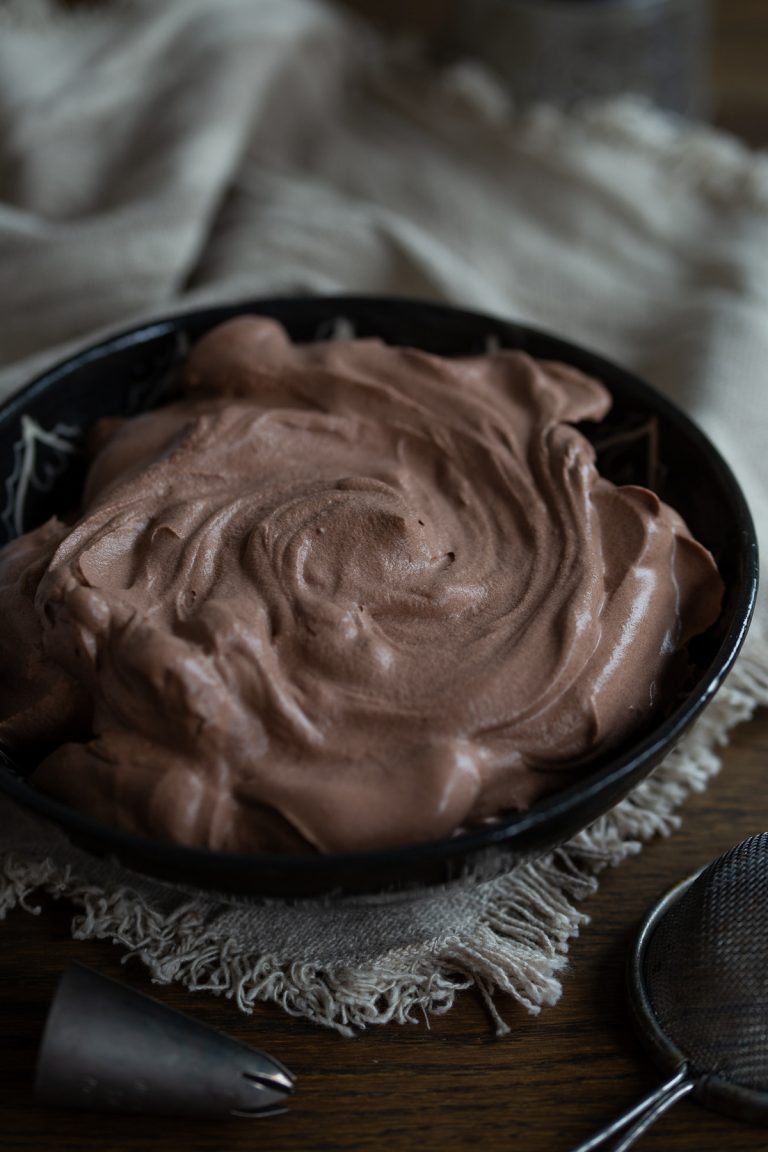 Cocoa whipped cream with the top nicely twirled to show texture.