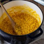 Saffron risotto in a Dutch oven pot.