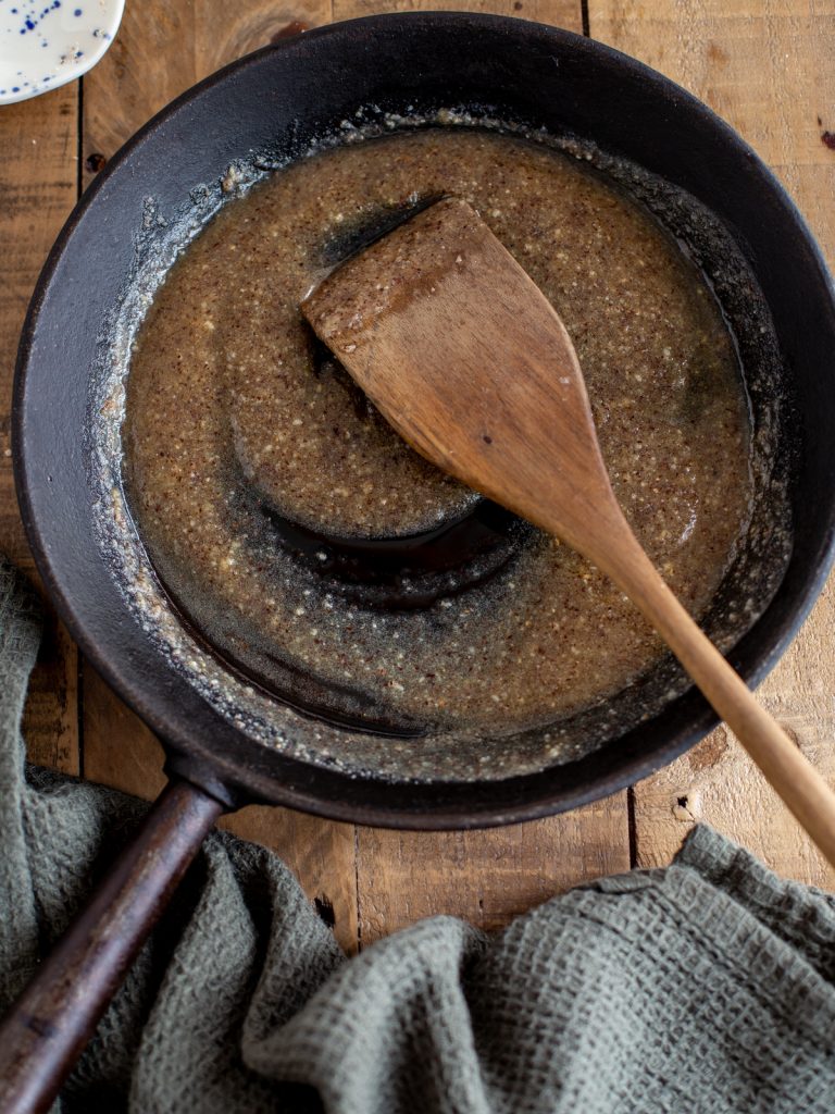 Preparing the hazelnut butter sauce in a skillet.