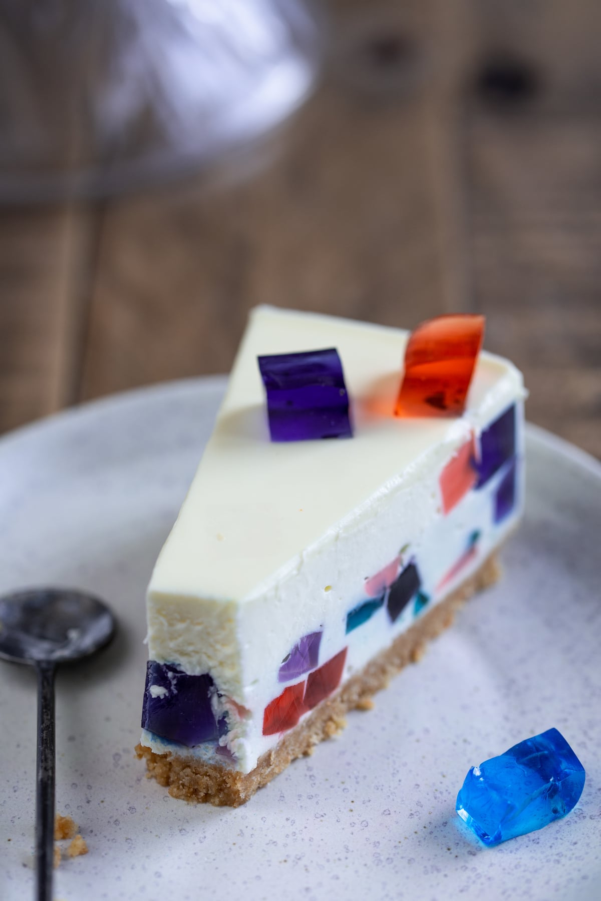 Slice of mosaic cheesecake with a teaspoon next to it.