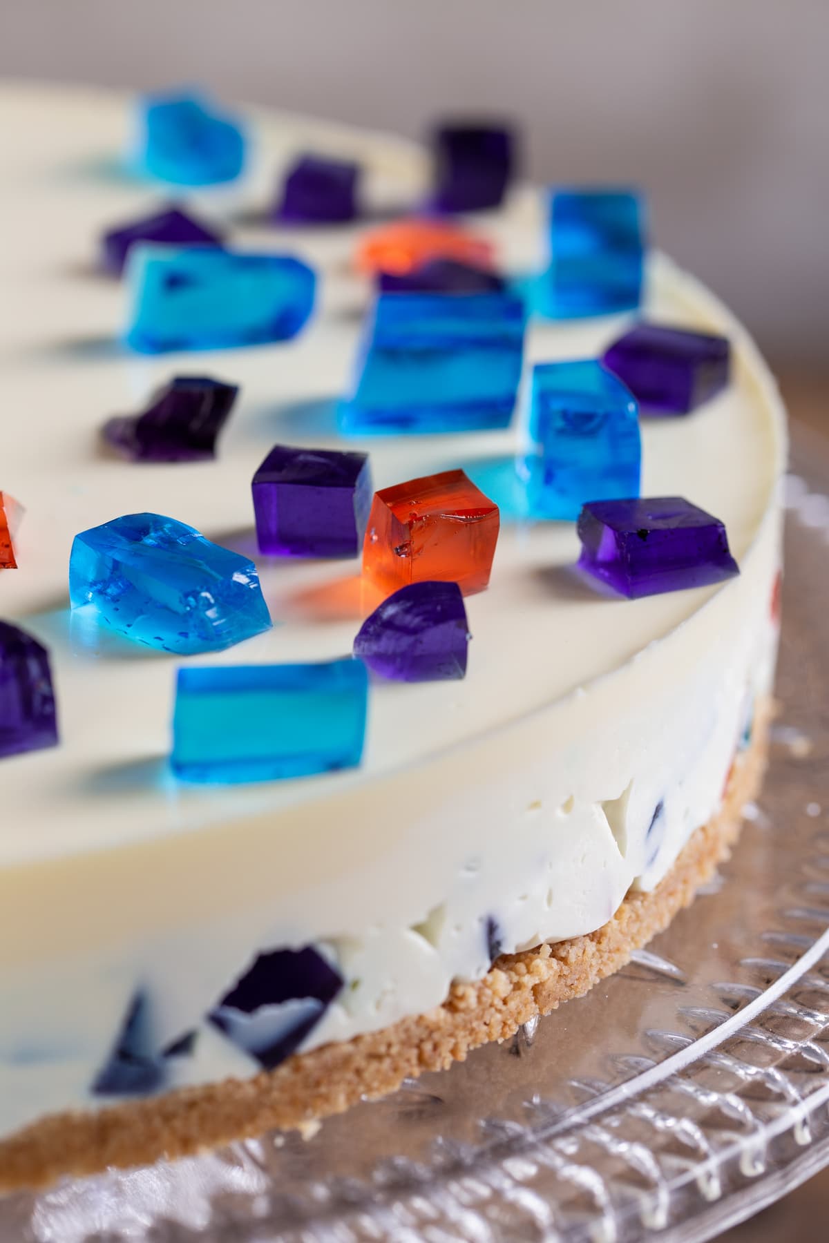 Mosaic cheesecake decorated with diced jello.