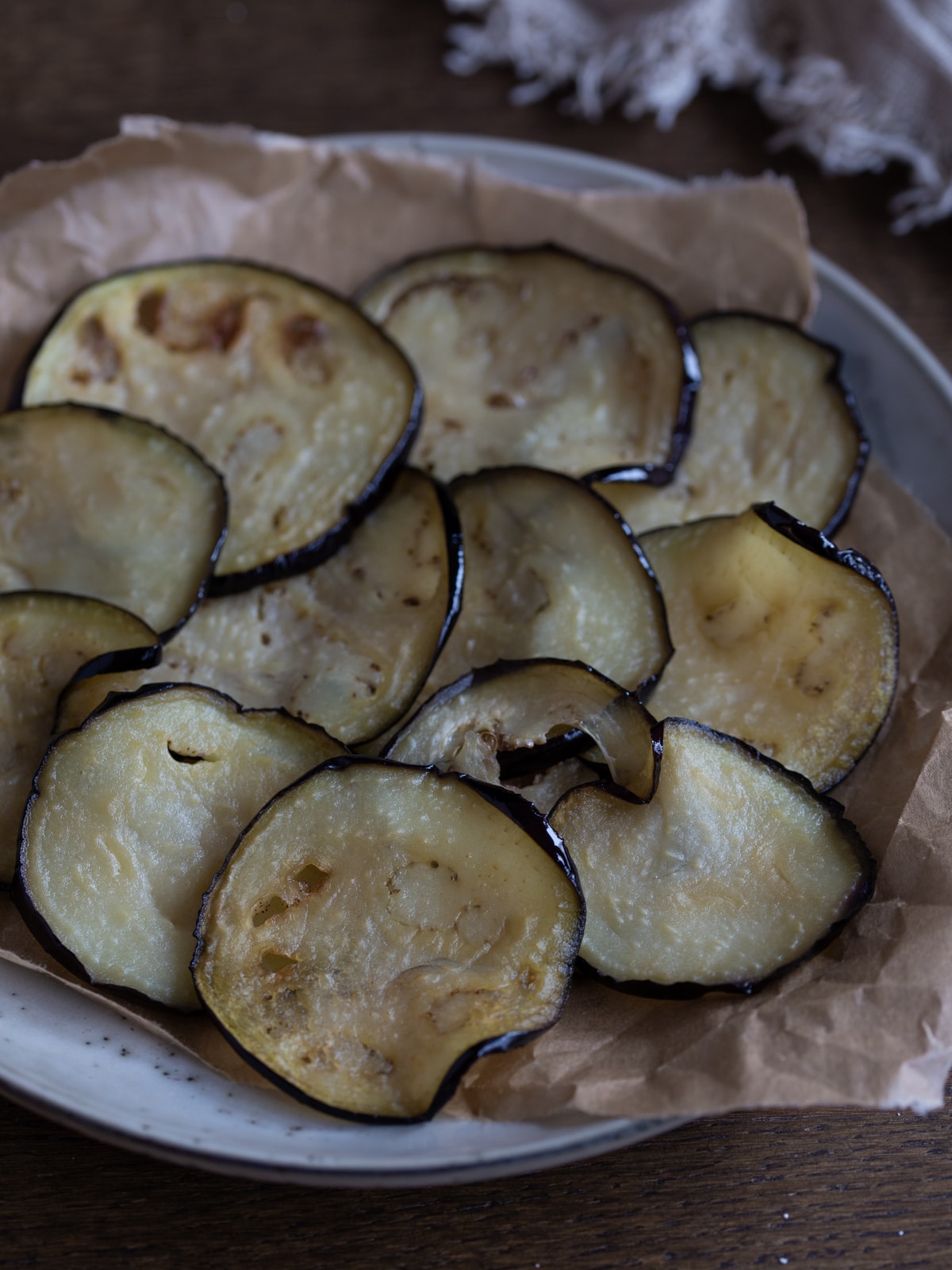 Fried eggplant slices on a plate.