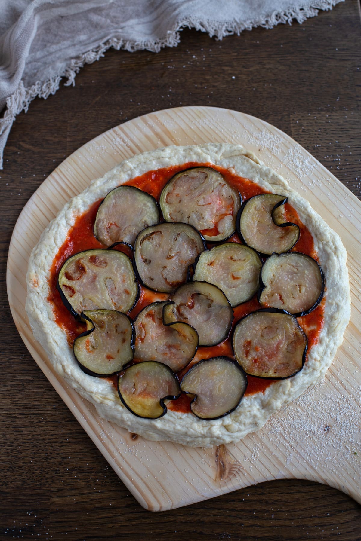 Fried eggplant slices on pizza.